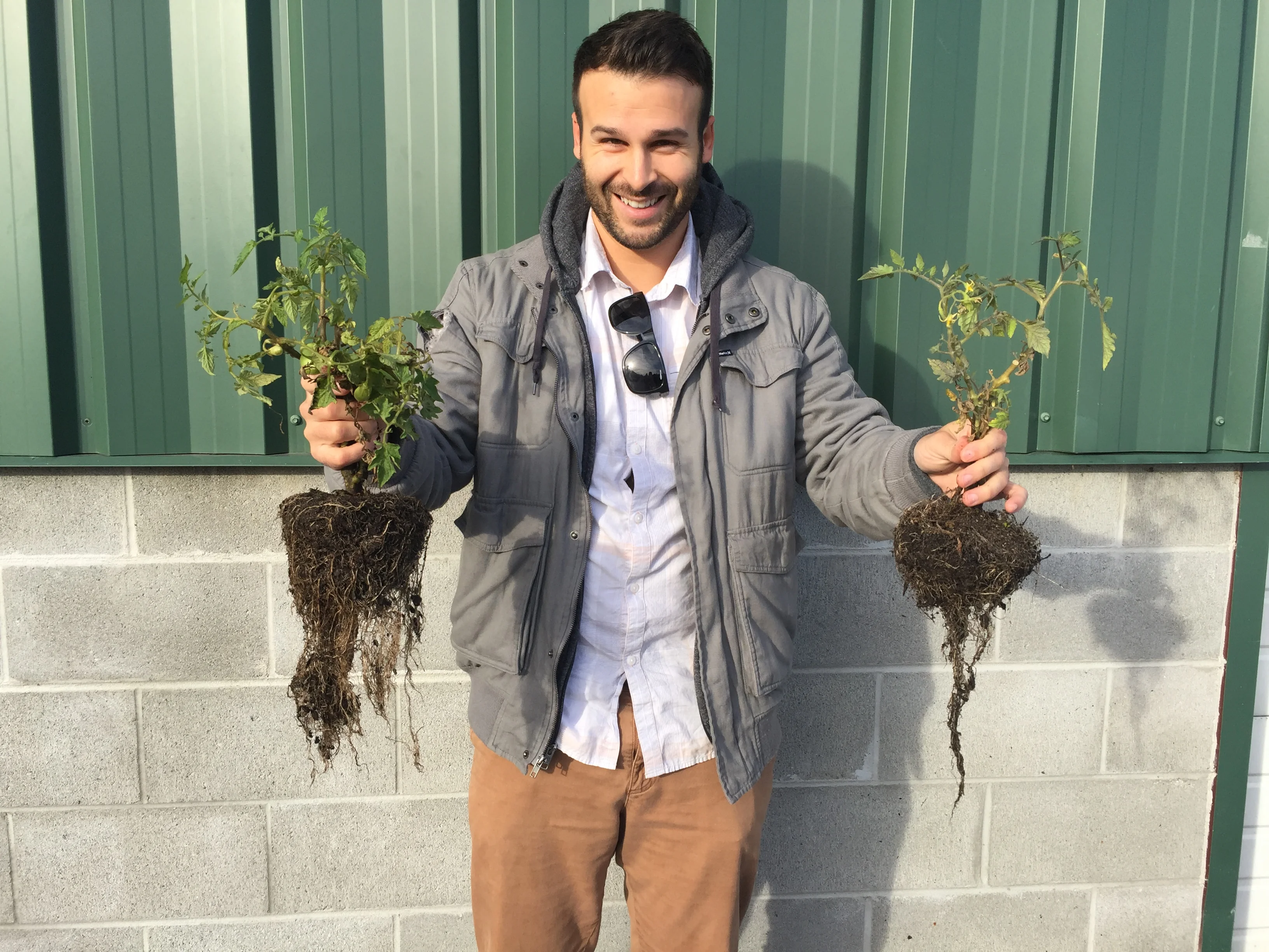 Zack Amaranthus holding plants